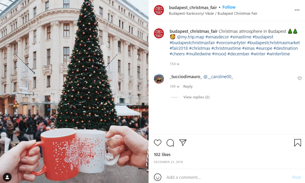 The large, decorated tree and mugs of mulled wine at  Budapest Christmas Fair 